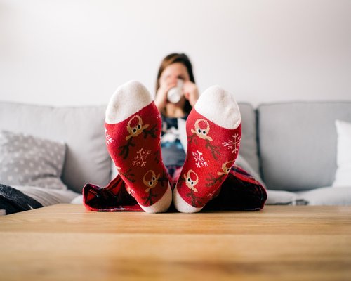 person enjoying a cozy living room with warm ambient lighting